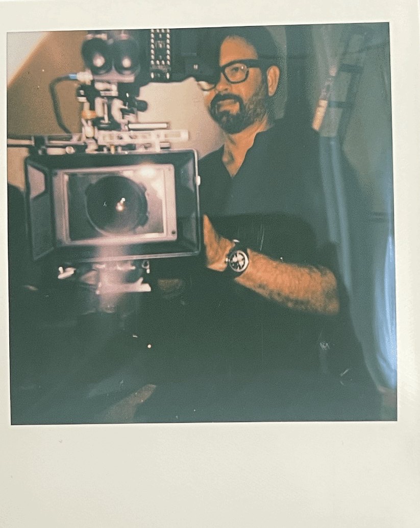 A Polaroid of Jeffrey Vogeding behind a cinema camera