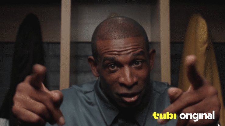 Coach Prime for Tubi: a coach pointing at camera in a locker room