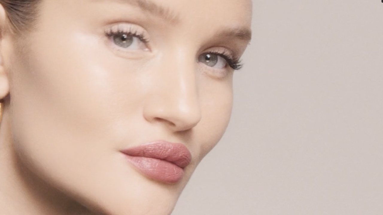 Rose Inc.: beauty close-up on a pale ground